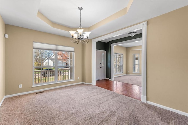 122 Tennessee Walker Way, Saint Peters, MO 63376 - carpeted empty room featuring a chandelier, baseboards, and a raised ceiling