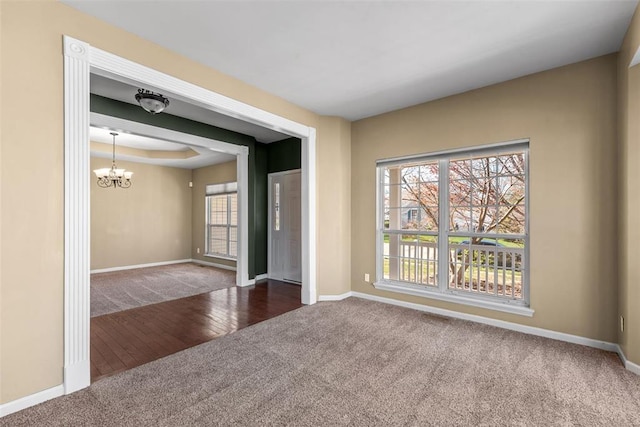 122 Tennessee Walker Way, Saint Peters, MO 63376 - unfurnished room with carpet floors, a chandelier, baseboards, and healthy amount of natural light