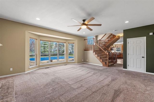 122 Tennessee Walker Way, Saint Peters, MO 63376 - unfurnished living room featuring ceiling fan, carpet flooring, baseboards, stairs, and recessed lighting