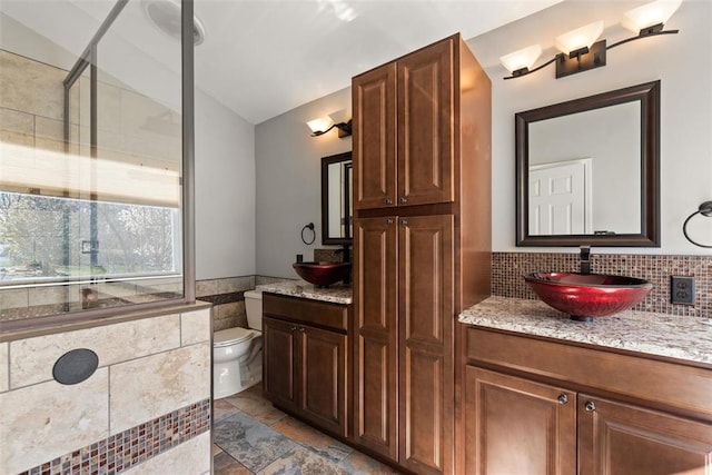 122 Tennessee Walker Way, Saint Peters, MO 63376 - full bath with vanity, toilet, vaulted ceiling, a wainscoted wall, and tile walls