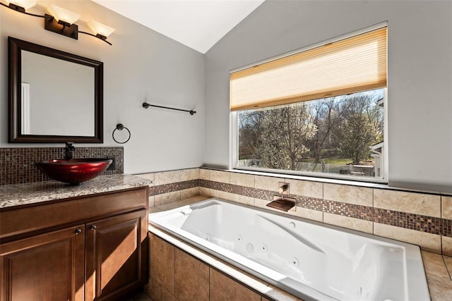 122 Tennessee Walker Way, Saint Peters, MO 63376 - full bathroom featuring lofted ceiling, a tub with jets, and vanity