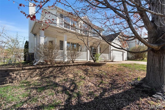 122 Tennessee Walker Way, Saint Peters, MO 63376 - view of front facade featuring a porch, a chimney, a garage, and concrete driveway