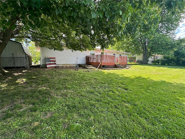 1110 W 3rd St, Salem, MO 65560 - view of green lawn with a wooden deck and an outbuilding