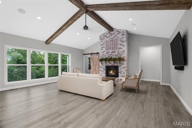 116 Brian Trl, Arnold, MO 63010 - living area with light wood-style flooring, recessed lighting, baseboards, a barn door, and a fireplace