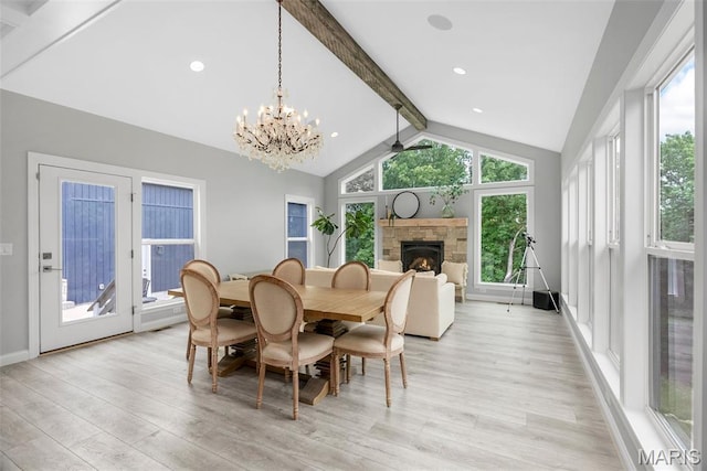 116 Brian Trl, Arnold, MO 63010 - dining space with light wood-style flooring, a fireplace, a chandelier, and baseboards