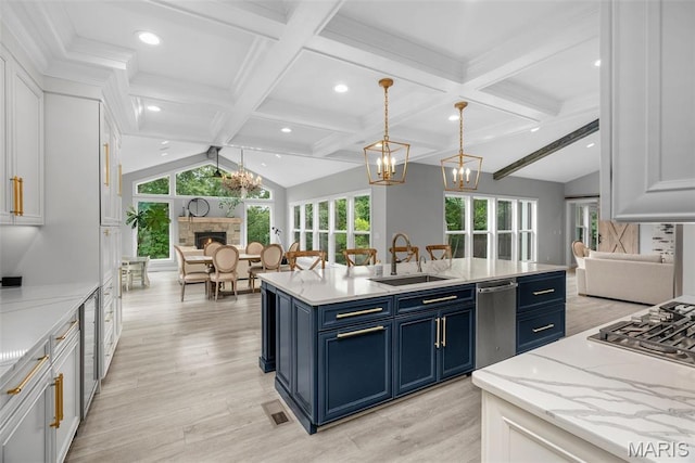 116 Brian Trl, Arnold, MO 63010 - kitchen with open floor plan, blue cabinetry, a sink, stainless steel appliances, and recessed lighting