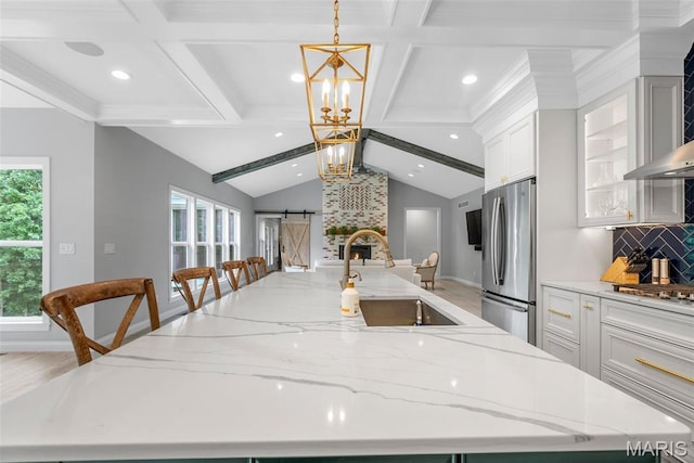 116 Brian Trl, Arnold, MO 63010 - kitchen with appliances with stainless steel finishes, a sink, a large island with sink, open floor plan, and tasteful backsplash
