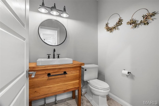 116 Brian Trl, Arnold, MO 63010 - half bathroom featuring toilet, vanity, and baseboards