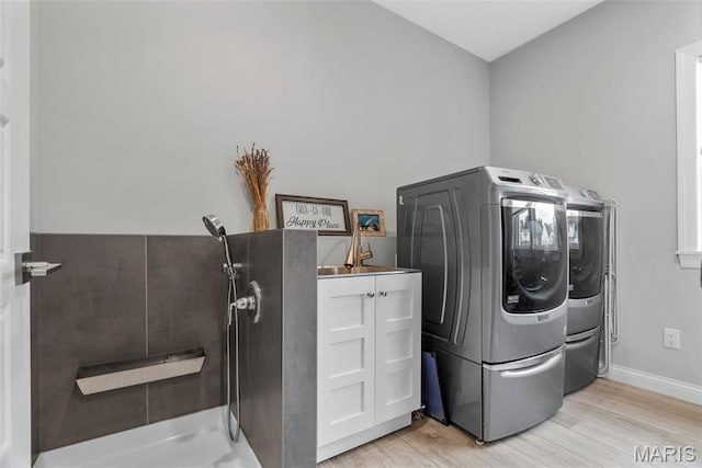 116 Brian Trl, Arnold, MO 63010 - laundry area featuring washer and dryer, light wood-style floors, and baseboards