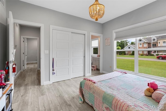 116 Brian Trl, Arnold, MO 63010 - bedroom featuring a chandelier, baseboards, and wood finished floors