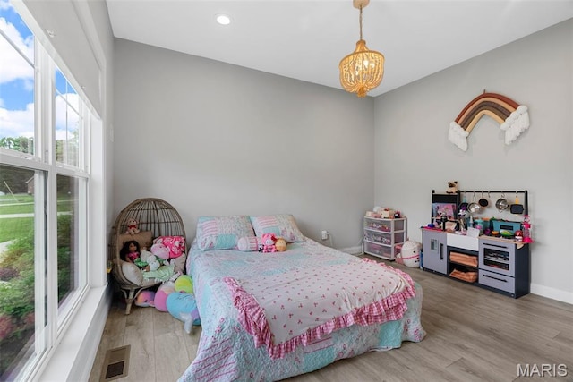 116 Brian Trl, Arnold, MO 63010 - bedroom featuring a chandelier, wood finished floors, recessed lighting, and baseboards