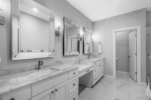 116 Brian Trl, Arnold, MO 63010 - bathroom with double vanity, marble look tile flooring, and baseboards