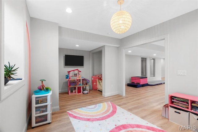 116 Brian Trl, Arnold, MO 63010 - rec room featuring a chandelier, wood finished floors, baseboards, and recessed lighting