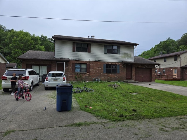 1033 Ne Village Lane Ne, Cape Girardeau, MO 63701 - traditional home featuring brick siding, concrete driveway, a garage, and a front lawn