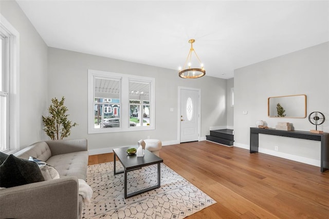 514 S Gore Ave, Saint Louis, MO 63119 - living area featuring a chandelier, wood finished floors, and baseboards