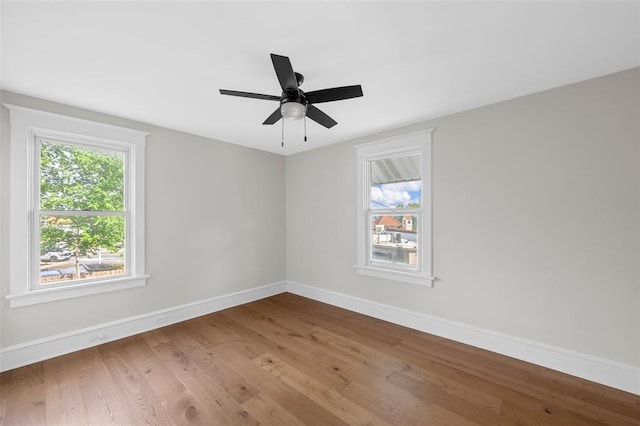 514 S Gore Ave, Saint Louis, MO 63119 - unfurnished room with baseboards, plenty of natural light, and wood-type flooring