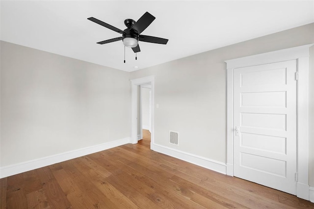 514 S Gore Ave, Saint Louis, MO 63119 - unfurnished room with baseboards, a ceiling fan, and wood finished floors
