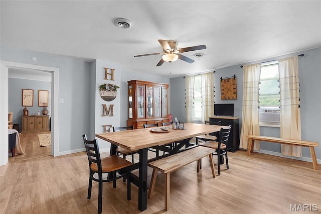 401 S Main St, New Florence, MO 63363 - dining space featuring ceiling fan, light wood finished floors, and baseboards