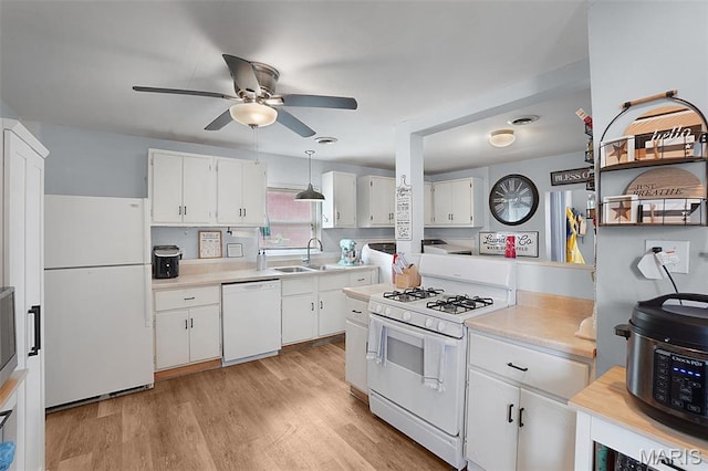 401 S Main St, New Florence, MO 63363 - kitchen with white appliances, a sink, ceiling fan, light countertops, and white cabinetry