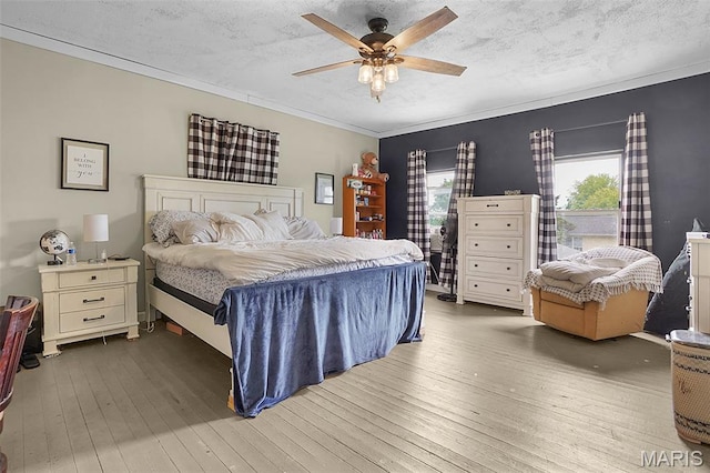 401 S Main St, New Florence, MO 63363 - bedroom with wood-type flooring, crown molding, ceiling fan, and a textured ceiling