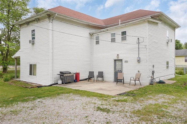 401 S Main St, New Florence, MO 63363 - rear view of house featuring a patio area, cooling unit, and a yard