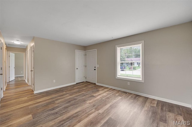 1448 Kathleen Dr, Wentzville, MO 63385 - spare room with wood finished floors and baseboards