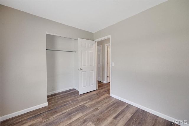 1448 Kathleen Dr, Wentzville, MO 63385 - unfurnished bedroom with wood finished floors and a closet