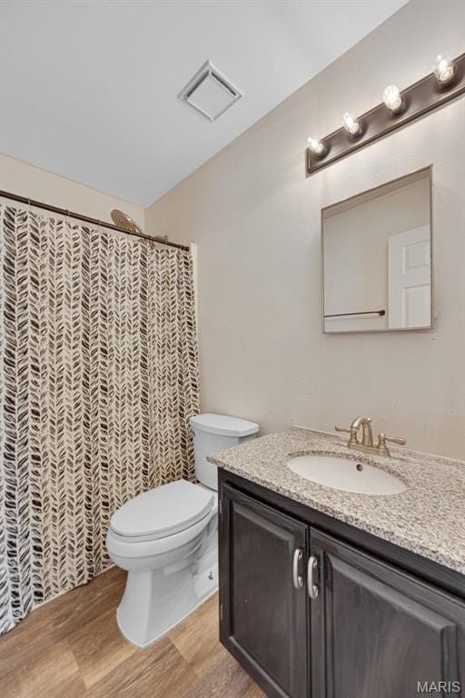 1448 Kathleen Dr, Wentzville, MO 63385 - bathroom with vanity, wood finished floors, and curtained shower
