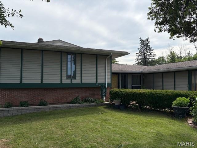 678 Henry Ave, Manchester, MO 63011 - view of side of home featuring brick siding and a lawn