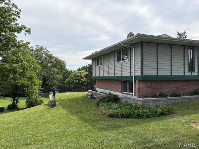 678 Henry Ave, Manchester, MO 63011 - view of home's exterior with a lawn and brick siding