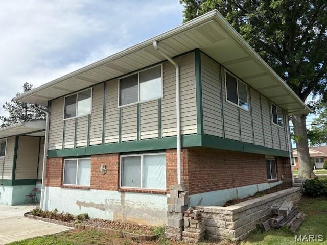 678 Henry Ave, Manchester, MO 63011 - view of home's exterior with brick siding