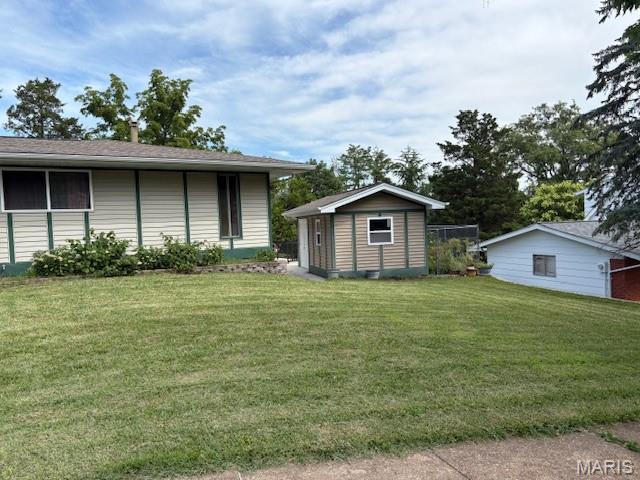 678 Henry Ave, Manchester, MO 63011 - view of grassy yard featuring a storage unit