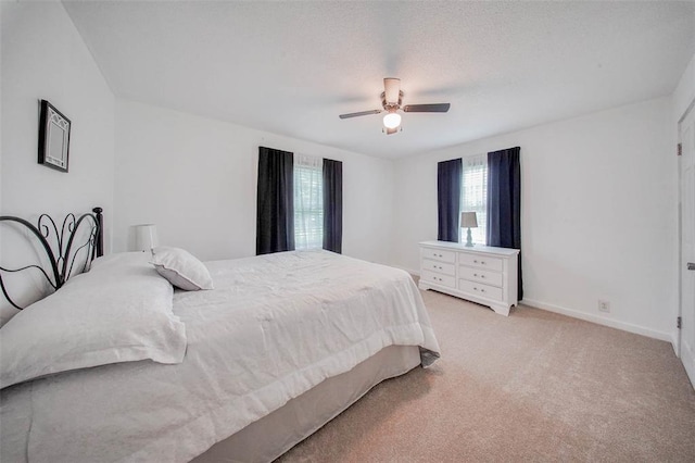 1707 S Mcarthur Ave, Salem, MO 65560 - bedroom featuring light carpet, baseboards, and a ceiling fan