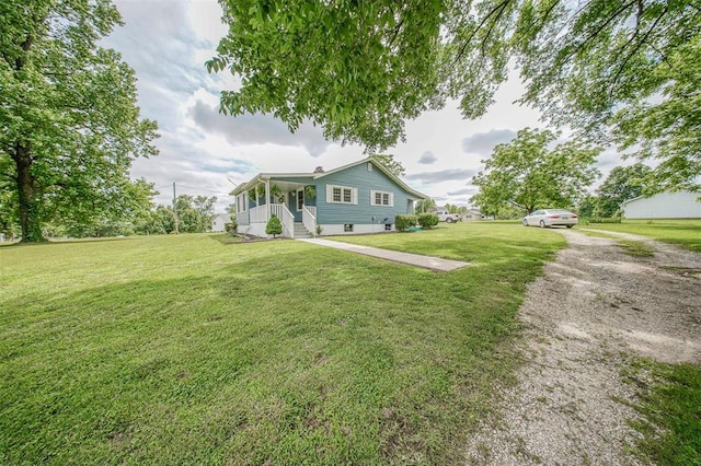 1707 S Mcarthur Ave, Salem, MO 65560 - view of front of home with driveway, covered porch, and a front yard