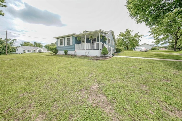 1707 S Mcarthur Ave, Salem, MO 65560 - view of front of house featuring covered porch and a front lawn