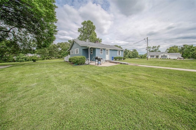 1707 S Mcarthur Ave, Salem, MO 65560 - view of front of home featuring a patio area, a chimney, and a front yard