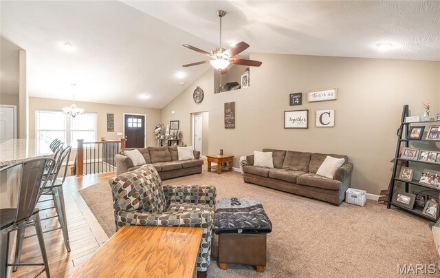 17050 Appaloosa Way, Rolla, MO 65401 - living area featuring a ceiling fan, lofted ceiling, a chandelier, and baseboards