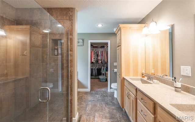 17050 Appaloosa Way, Rolla, MO 65401 - full bath featuring toilet, double vanity, a stall shower, a spacious closet, and baseboards