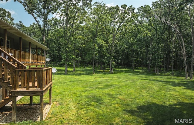 17050 Appaloosa Way, Rolla, MO 65401 - view of grassy yard featuring a wooden deck and stairway