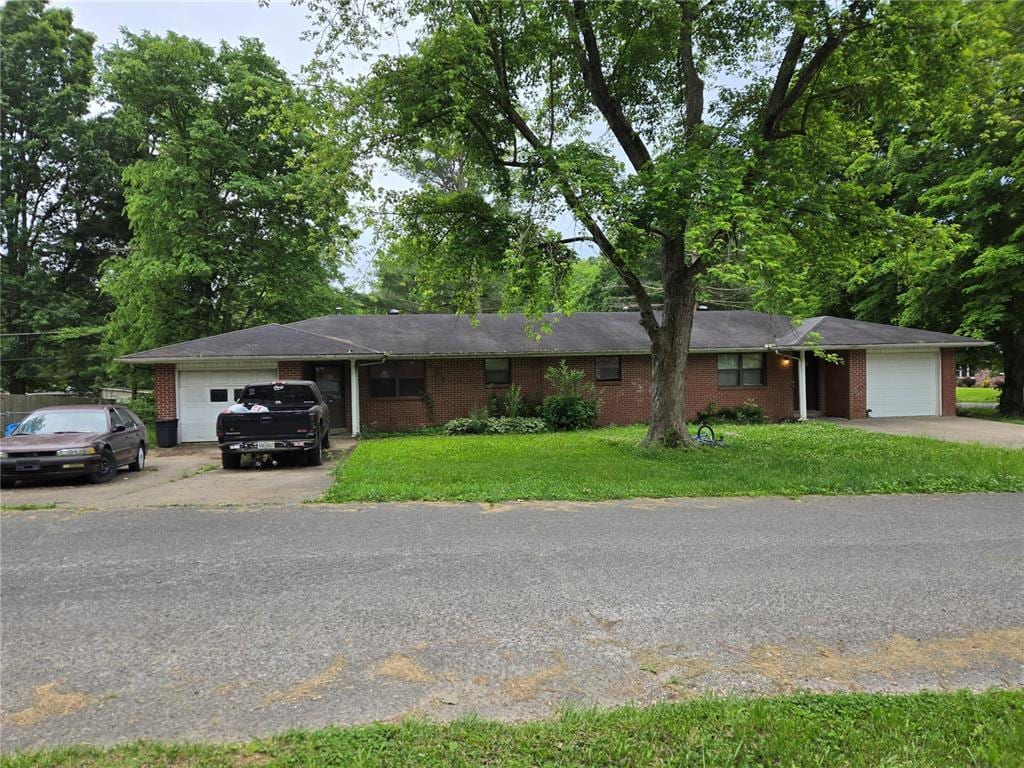 1017 NE Shady Ln NE Unit 2, Cape Girardeau, MO 63701 - ranch-style house featuring an attached garage, concrete driveway, and brick siding