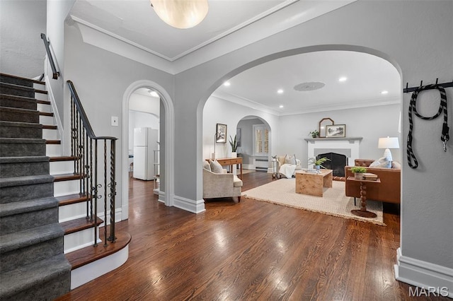 436 W Point Ct, Saint Louis, MO 63130 - foyer entrance featuring arched walkways, stairs, wood finished floors, crown molding, and recessed lighting