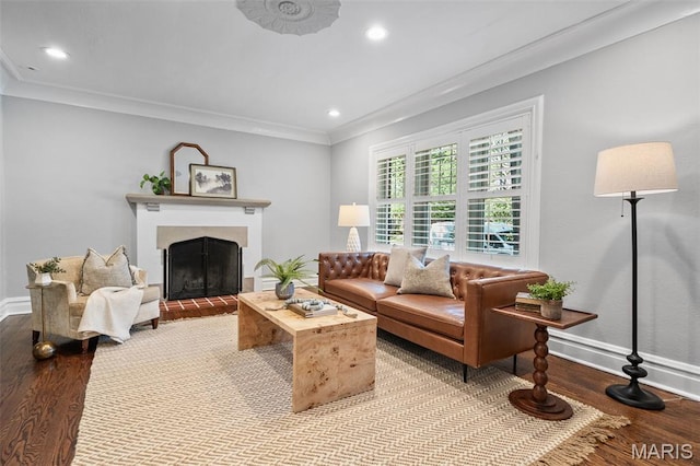 436 W Point Ct, Saint Louis, MO 63130 - living room with wood finished floors, a fireplace with raised hearth, crown molding, and recessed lighting