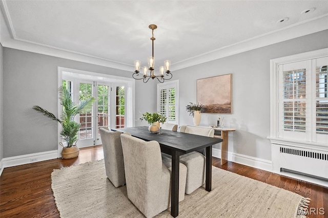 436 W Point Ct, Saint Louis, MO 63130 - dining area featuring radiator, a chandelier, ornamental molding, and wood finished floors