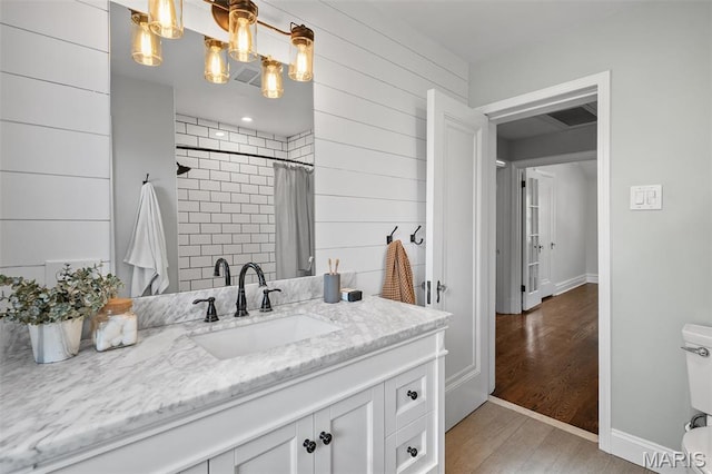 436 W Point Ct, Saint Louis, MO 63130 - bathroom with vanity, wood finished floors, and curtained shower