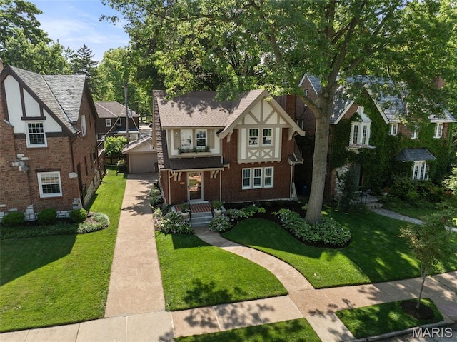 436 W Point Ct, Saint Louis, MO 63130 - english style home with a front yard, an outbuilding, a garage, and a chimney