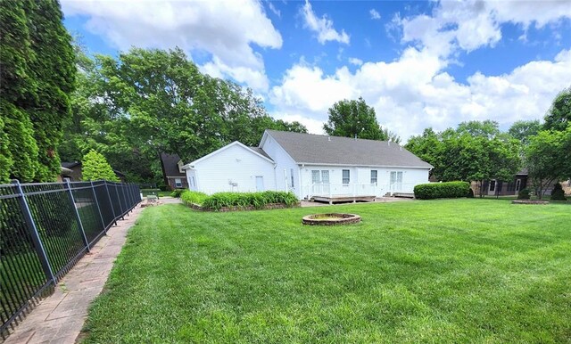 103 Northview Dr, Collinsville, IL 62234 - rear view of house with a fire pit and a wooden deck