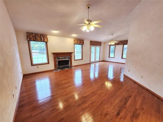 103 Northview Dr, Collinsville, IL 62234 - unfurnished living room with plenty of natural light, a ceiling fan, wood finished floors, and a fireplace