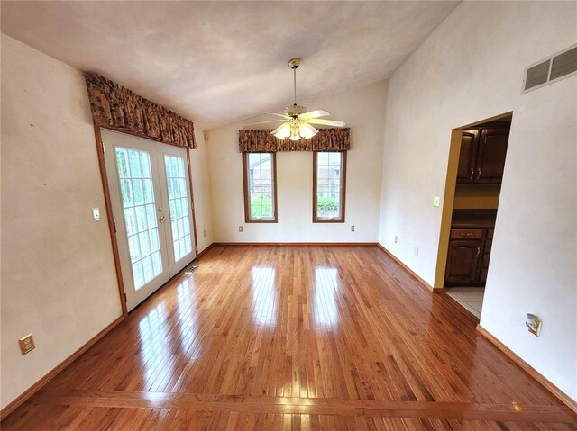 103 Northview Dr, Collinsville, IL 62234 - spare room featuring lofted ceiling, ceiling fan, light wood-type flooring, french doors, and baseboards