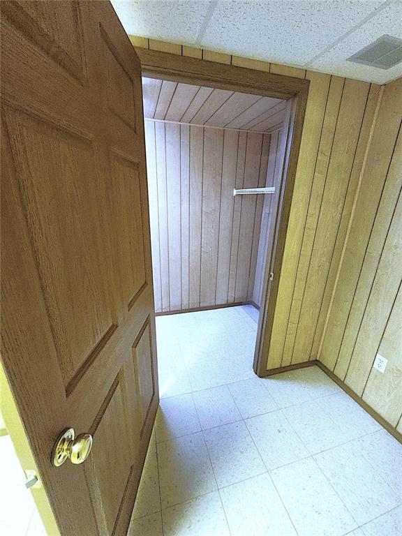 103 Northview Dr, Collinsville, IL 62234 - corridor with wooden walls and light flooring