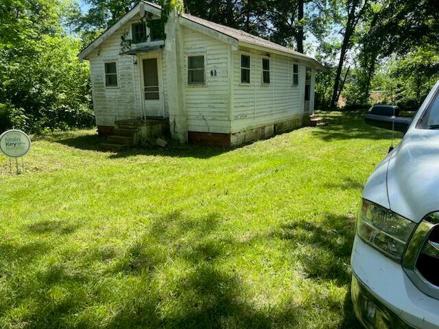 8048 Riverview Dr, Dittmer, MO 63023 - view of property exterior featuring a yard